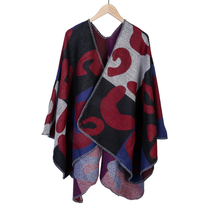 Dam oversized Ruana med abstract graphic jacquard och decorative overlock seam