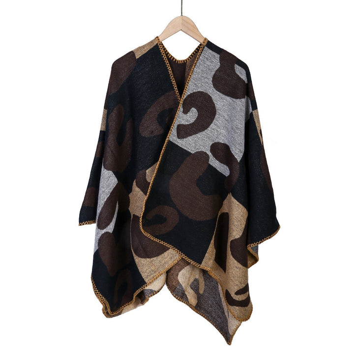 Dam oversized Ruana med abstract graphic jacquard och decorative overlock seam