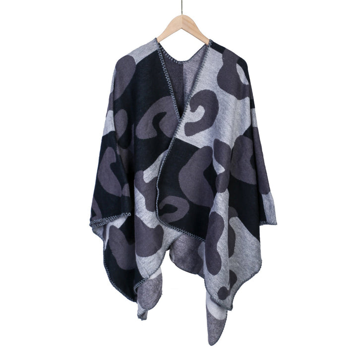 Dam oversized Ruana med abstract graphic jacquard och decorative overlock seam