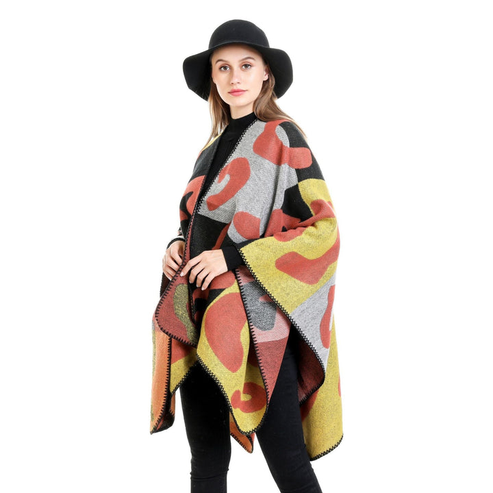 Dam oversized Ruana med abstract graphic jacquard och decorative overlock seam