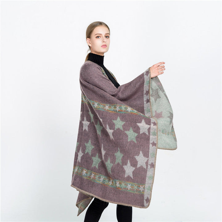 Dam Jacquard Ruana poncho med star jacquard och softly falling oversized silhuett