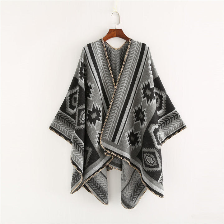 Dam Ethno-Jacquard Ruana-poncho med boxy oversized passform och decorative chain stitch.