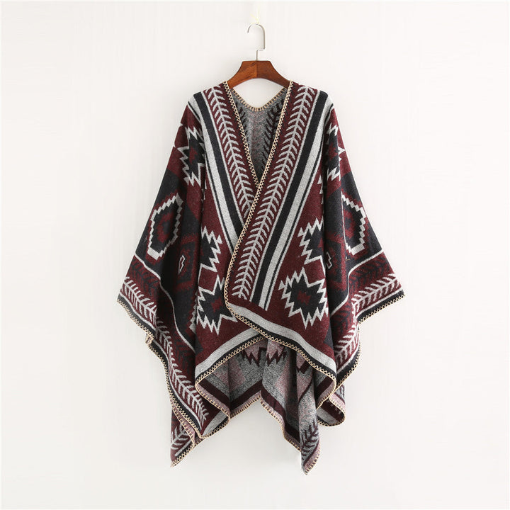 Dam Ethno-Jacquard Ruana-poncho med boxy oversized passform och decorative chain stitch.