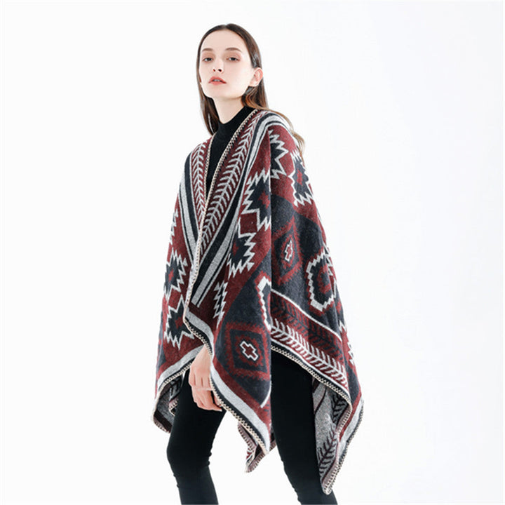Dam Ethno-Jacquard Ruana-poncho med boxy oversized passform och decorative chain stitch.
