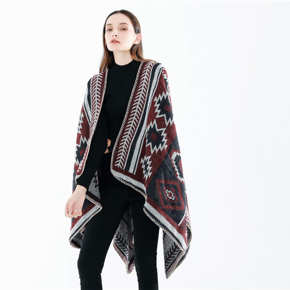 Dam Ethno-Jacquard Ruana-poncho med boxy oversized passform och decorative chain stitch.