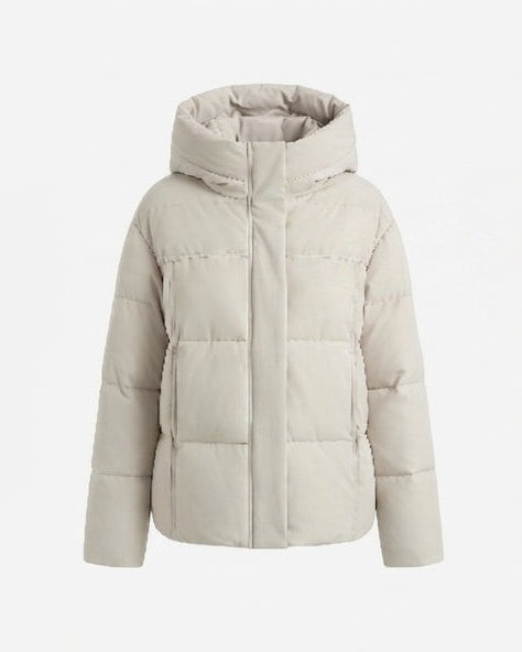 Dam kort boxy kviltad puffer med integrated huva och sido zip fickor