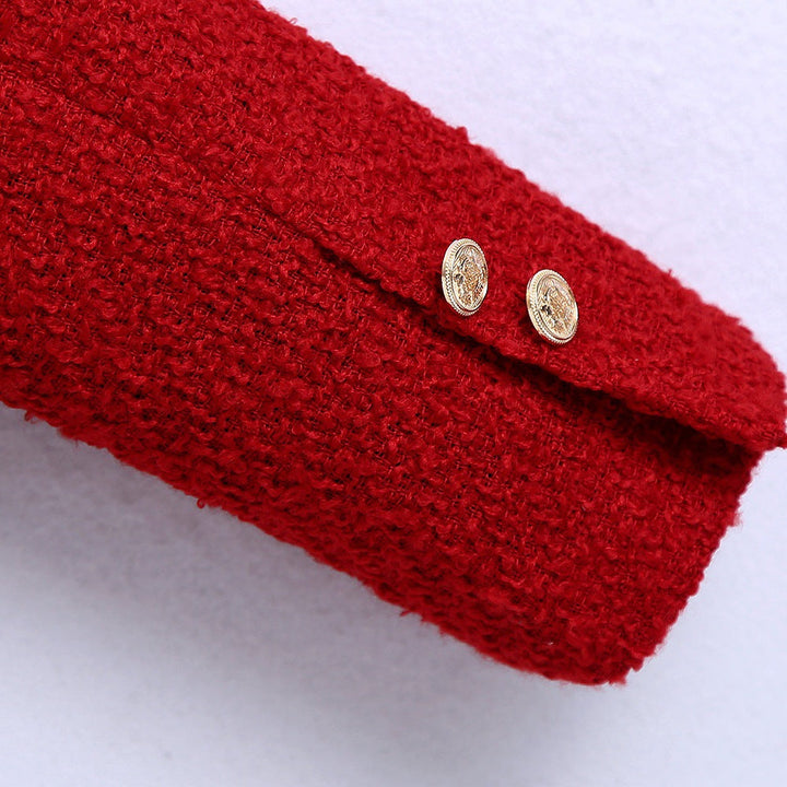 Dam kort jacka gjord bouclé tweed in a kort skärning med a round neckline och golden dekorativ knappar