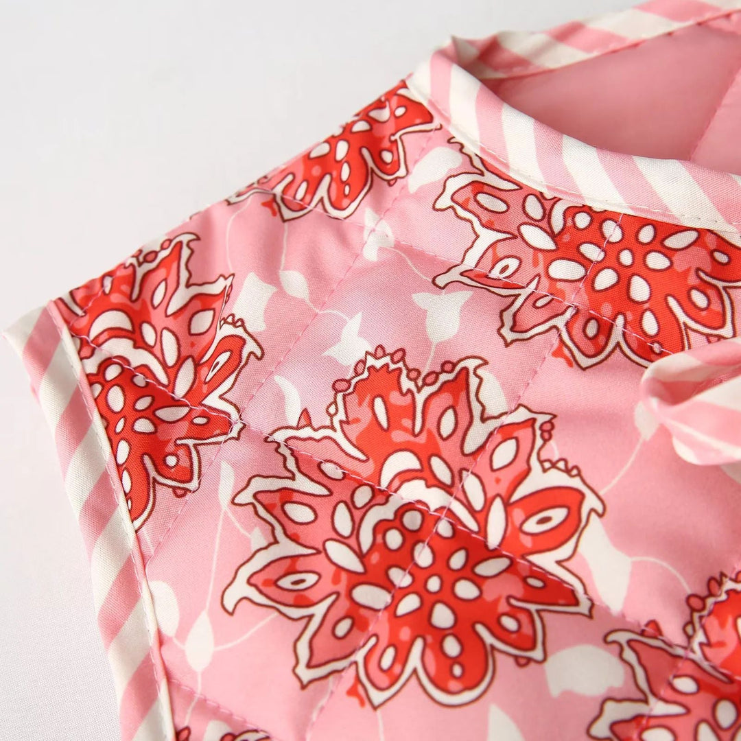 Dam quiltad vests med floral alla-över mönster och ties
