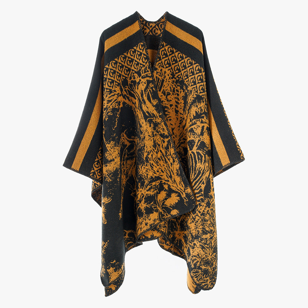 Dam jacquard stickad cape med ståkrage och graphic forest design