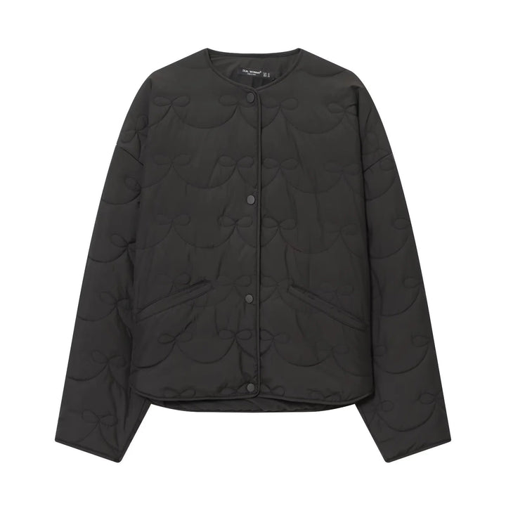 Dam vadderad kort jacka med bow quiltning och round neckline