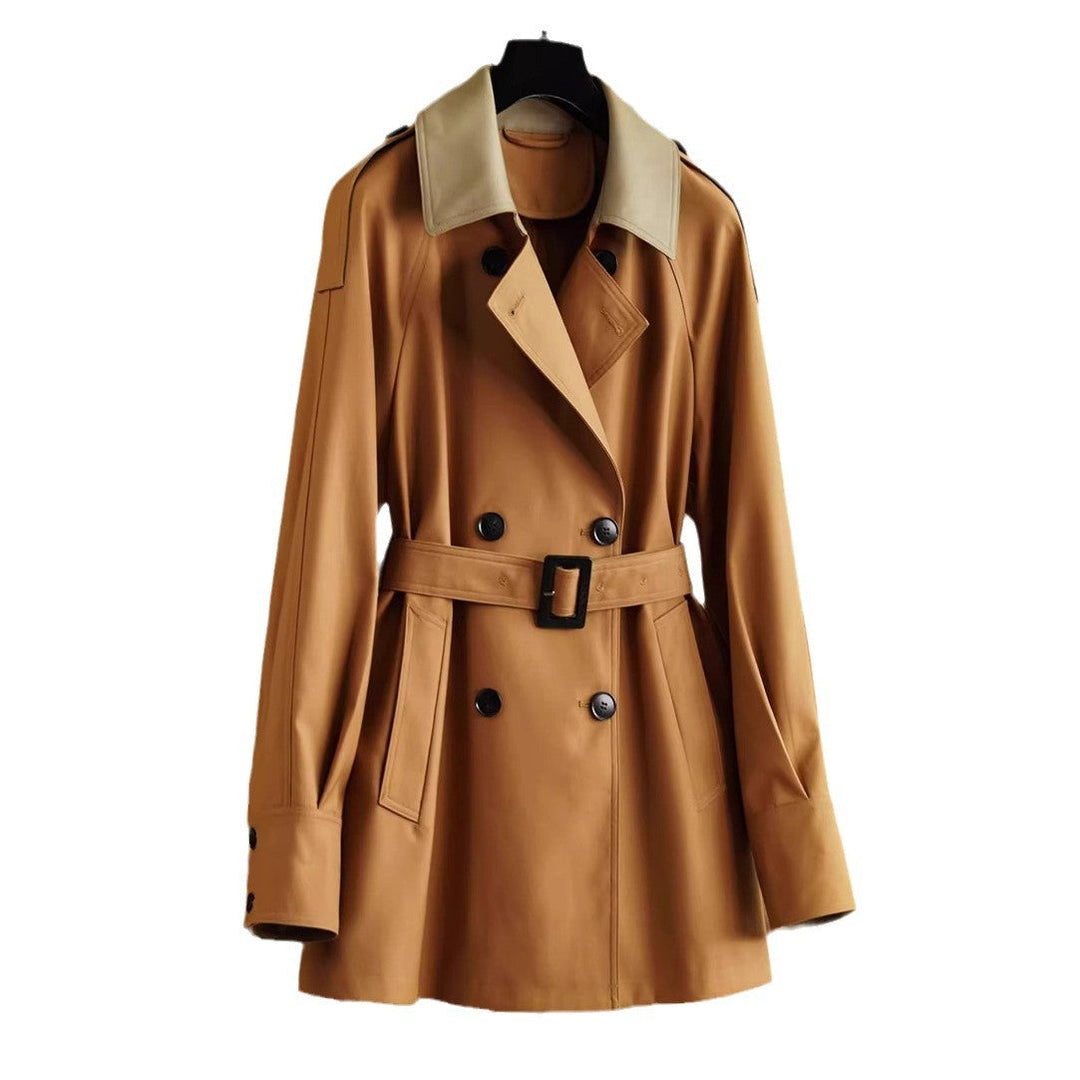 Dam elegantly skräddad trenchcoat med a belted midja