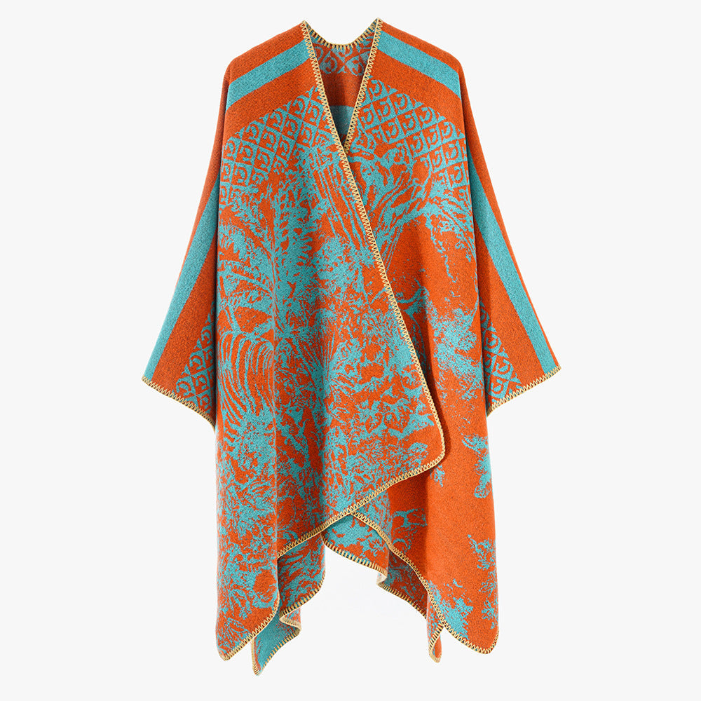 Dam jacquard stickad cape med ståkrage och graphic forest design