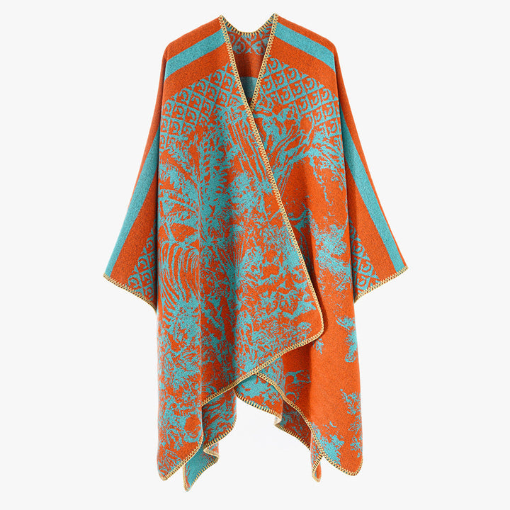 Dam jacquard stickad cape med ståkrage och graphic forest design