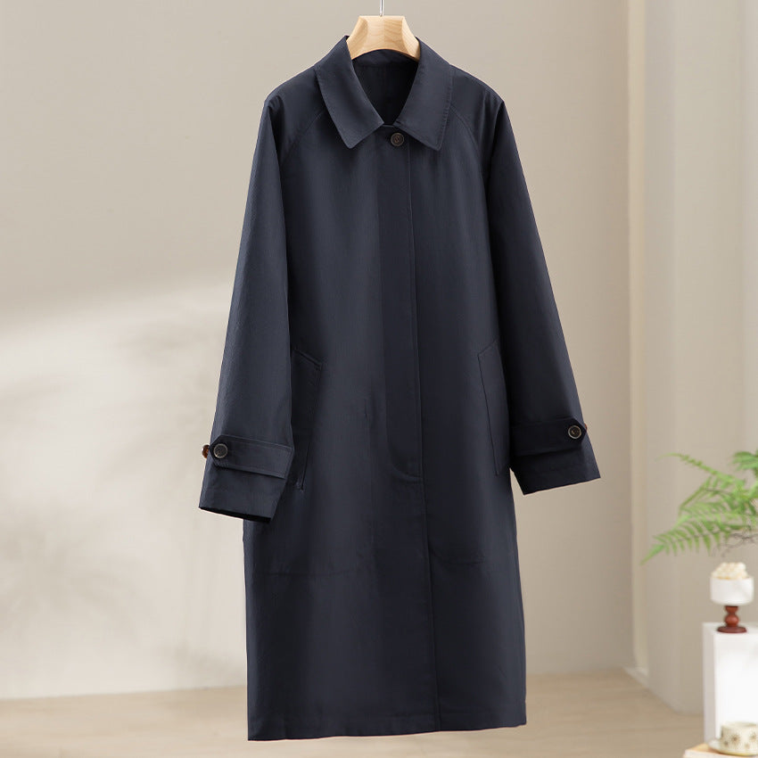 Dam längre minimalistisk trenchcoat med dold knappslå och justerbar muddar