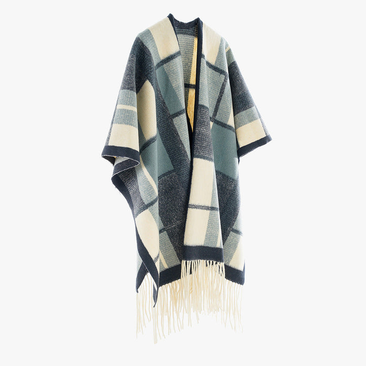Dam capeponcho i oversized rectangular skärning med rutig weave structure och fringes.
