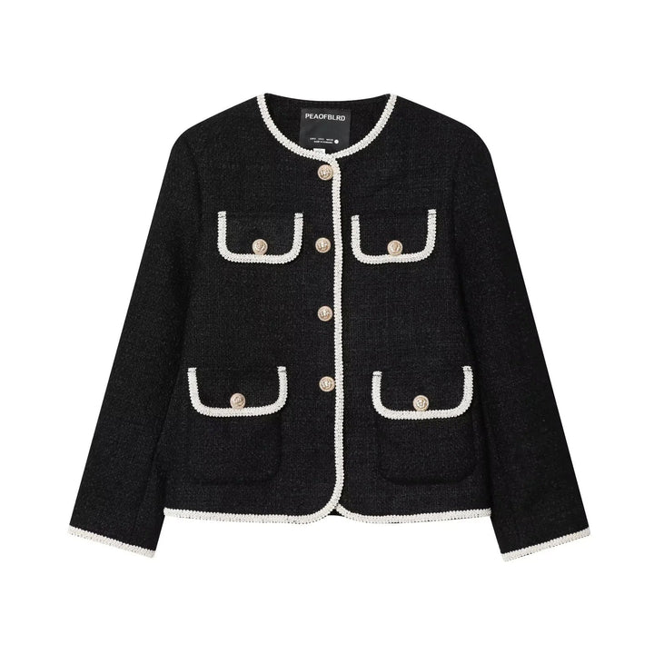 Dam klassisk Boucle jacka med kontrasterande piping och decorative knappar