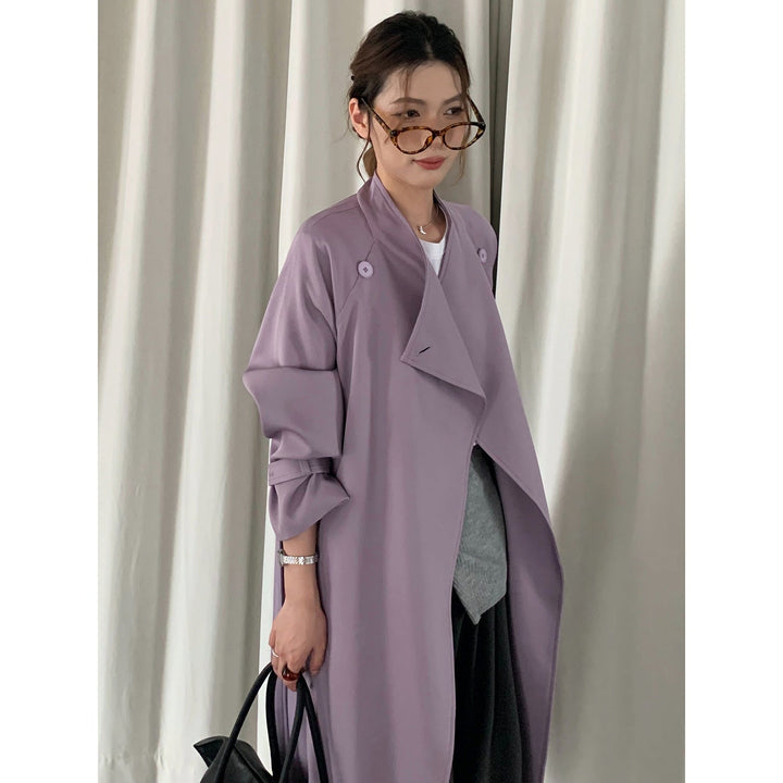 Dam oversize trenchcoat med midjebälte, slagkrage, och justerbar muddar