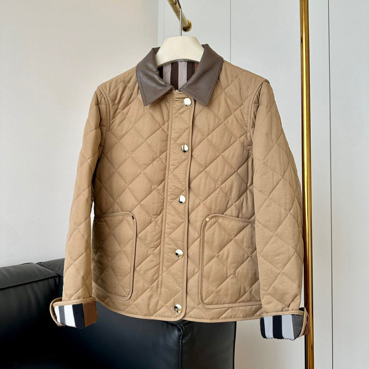Dam modern kviltad jacka med elegant läder krage