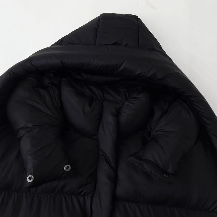 Dam oversized quiltad jacka med voluminous huva och påsydda fickor