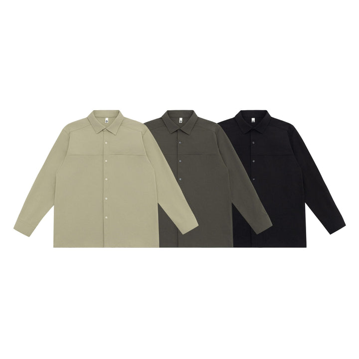 Unisex Lång Modell Skjorta Jacka i Boxig Skärning Gjord av Kraftig Sweat Quality med Concealed Tryckknappsslå