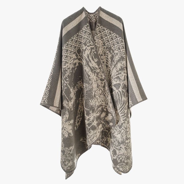 Dam jacquard stickad cape med ståkrage och graphic forest design