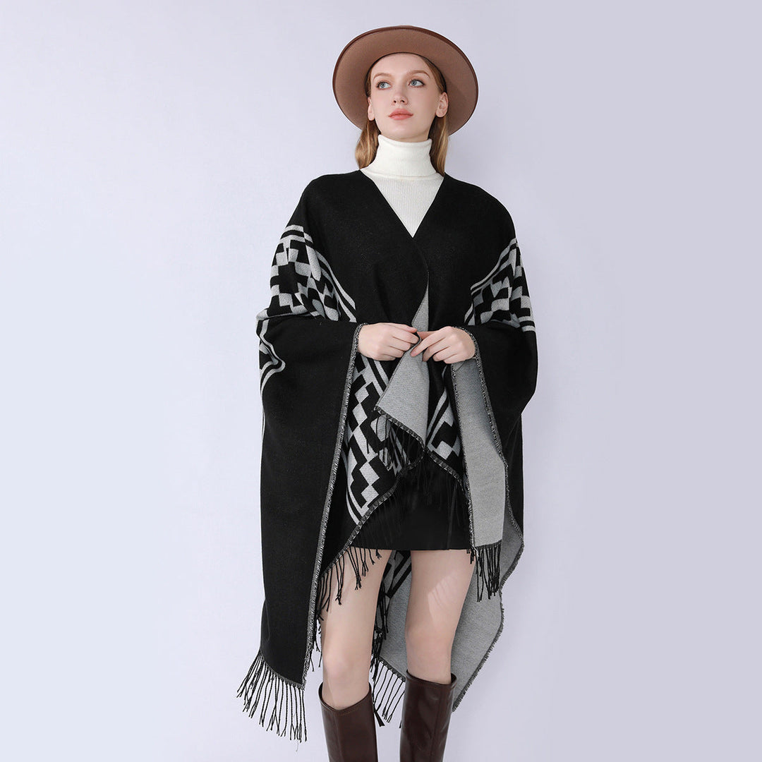 Dam Oversize Cape med geometric Jacquard, fransfåll och reversible function