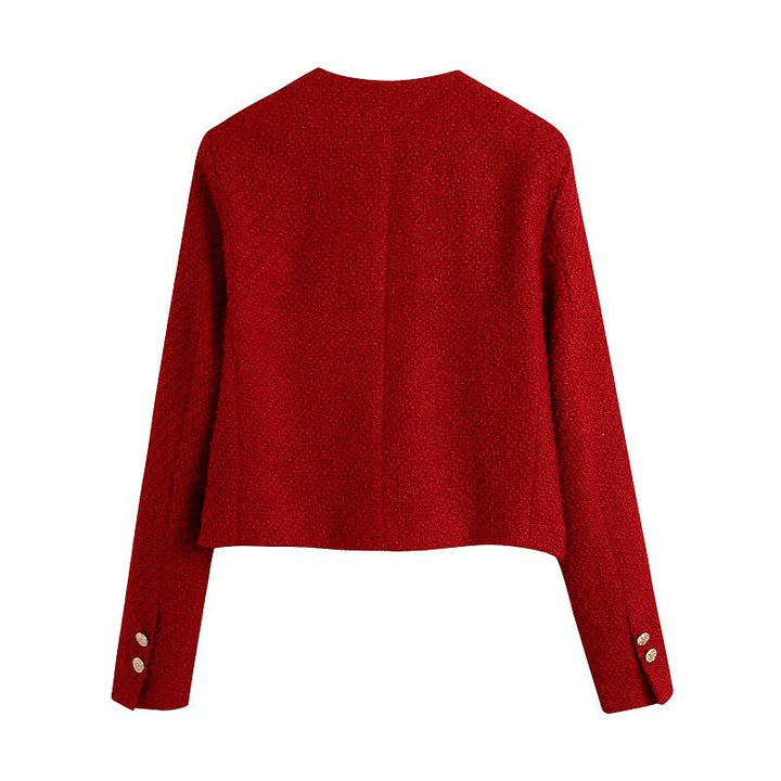 Dam kort jacka gjord bouclé tweed in a kort skärning med a round neckline och golden dekorativ knappar