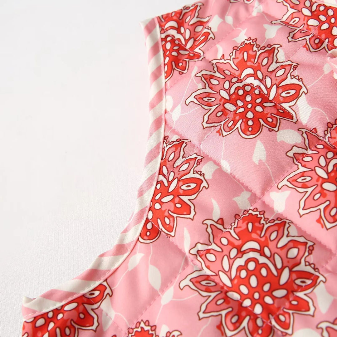 Dam quiltad vests med floral alla-över mönster och ties