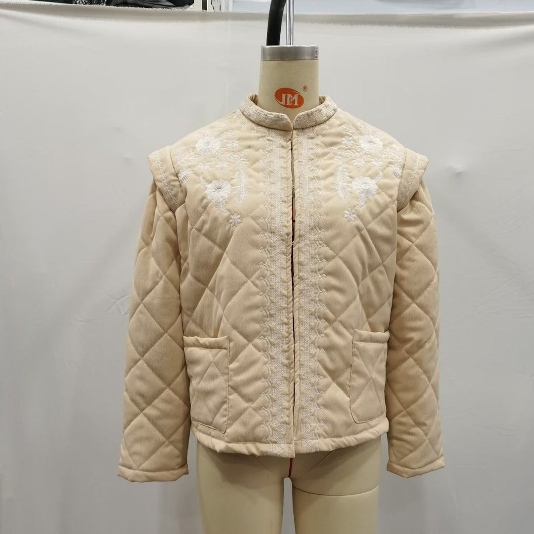 Dam quiltad jacka med floral embroidery kant, straight skärning och rund hals