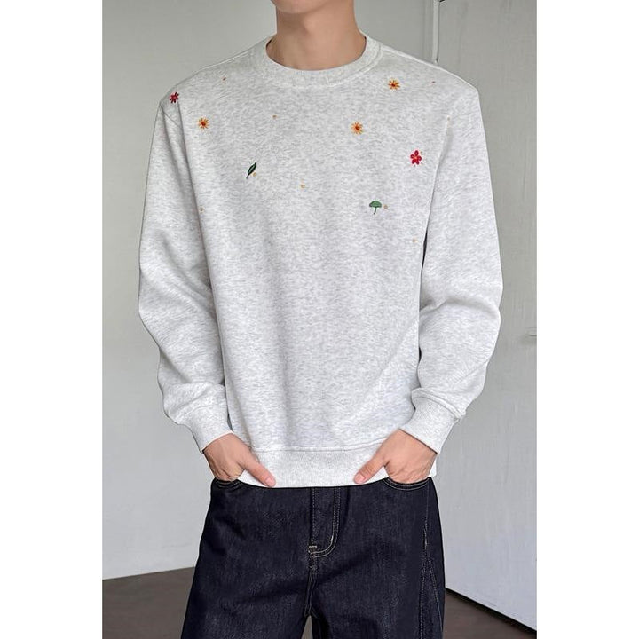 Herr Crew Neck College-Tröja med Minimalistisk Blommig Embroidery och Clean Skärning
