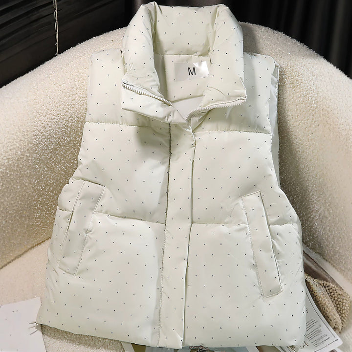 Dam non-quiltad sleeveless thermal väst med high standing krage, concealed dragkedja placket, och fine dot tryck