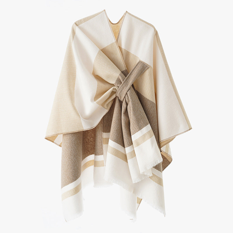Dam oversized capeponcho tillverkad av ullblandning med tie loop och randig border