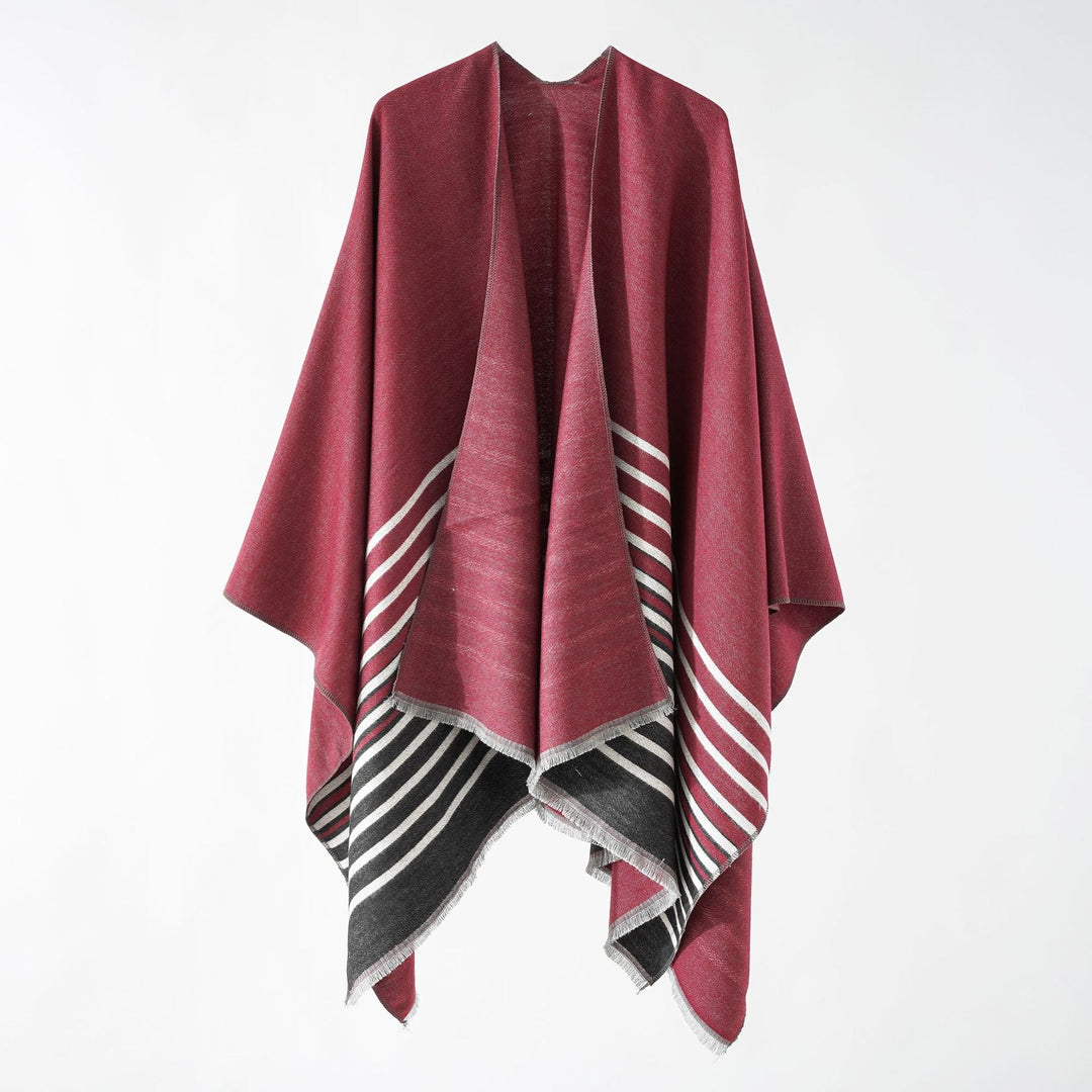 Dam oversized poncho med en boxy passform, featuring en diagonal stripe panel och finely fringed fåll.