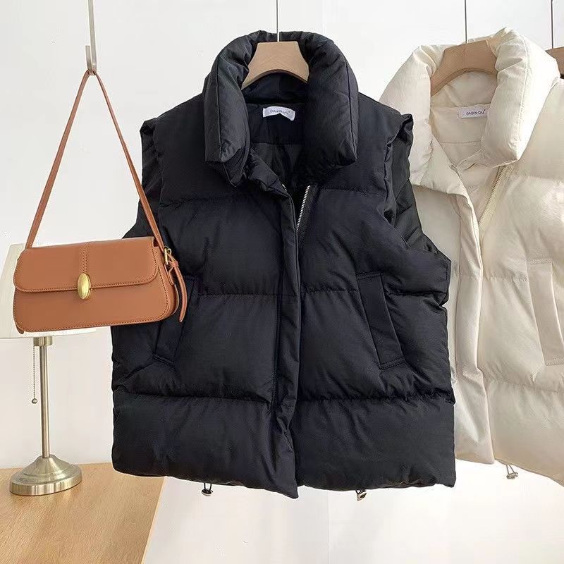 Dam kort vadderad quiltad väst med high sjalkrage och adjustable drawstring fåll