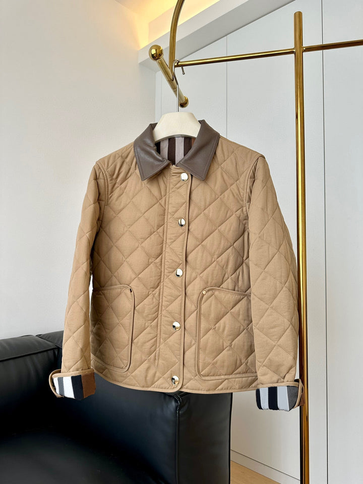 Dam modern kviltad jacka med elegant läder krage