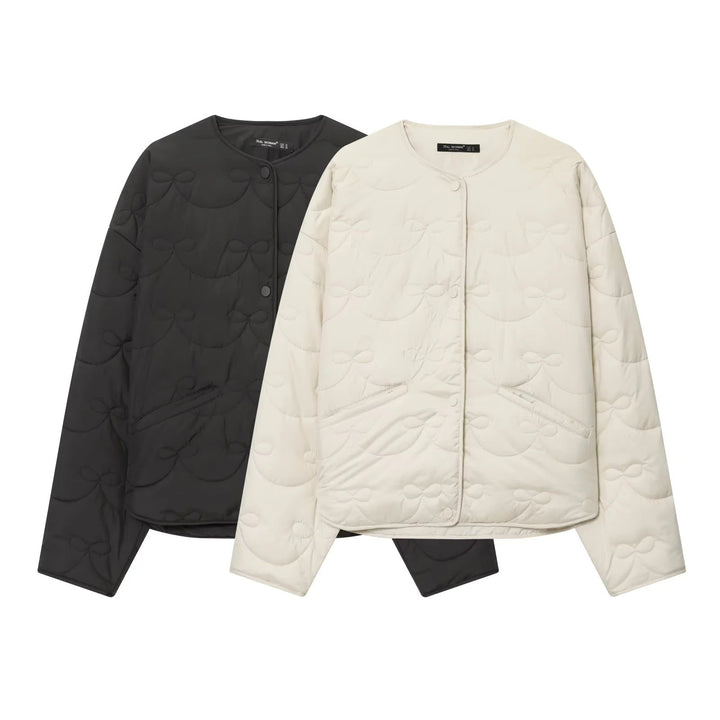 Dam vadderad kort jacka med bow quiltning och round neckline