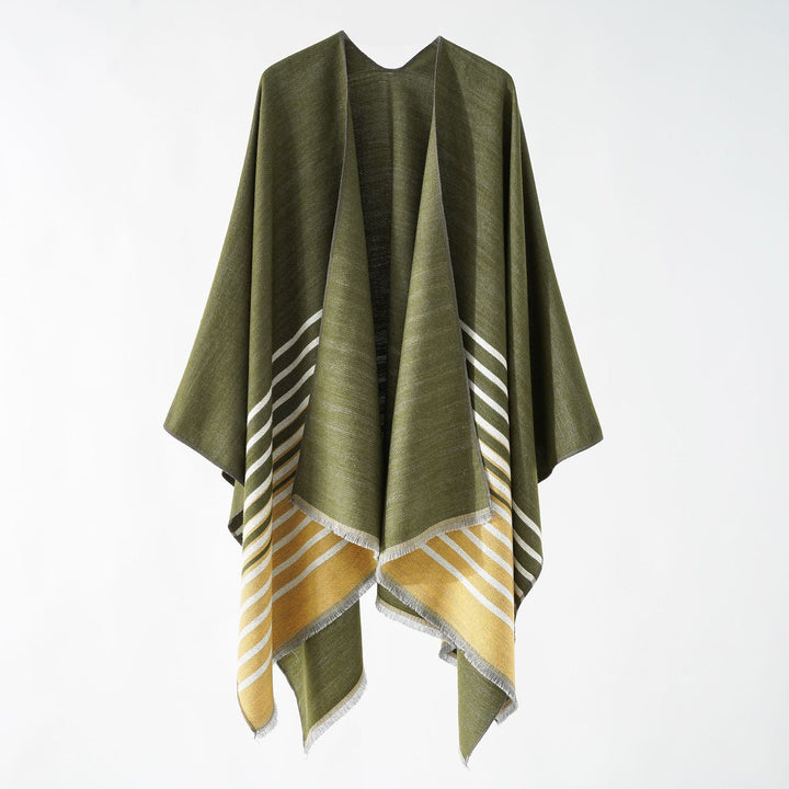 Dam oversized poncho med en boxy passform, featuring en diagonal stripe panel och finely fringed fåll.