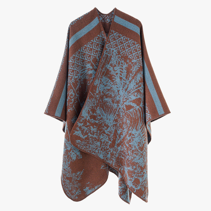Dam jacquard stickad cape med ståkrage och graphic forest design