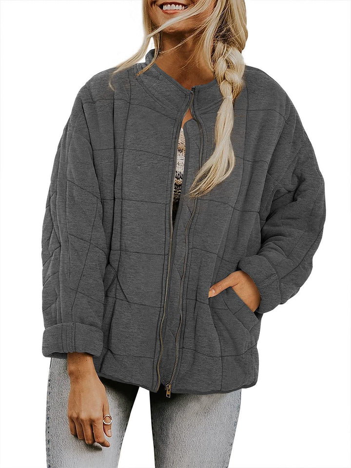 Dam oversize kviltad jacka med dragkedja och sidofickor
