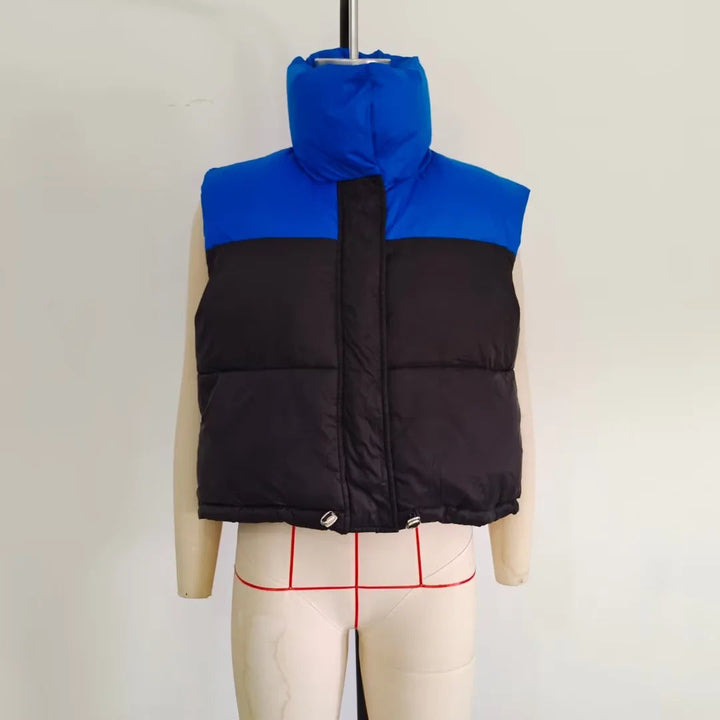 Dam sleeveless quiltad kort väst med high ståkrage, vadderad insulation, och adjustable drawstring fåll