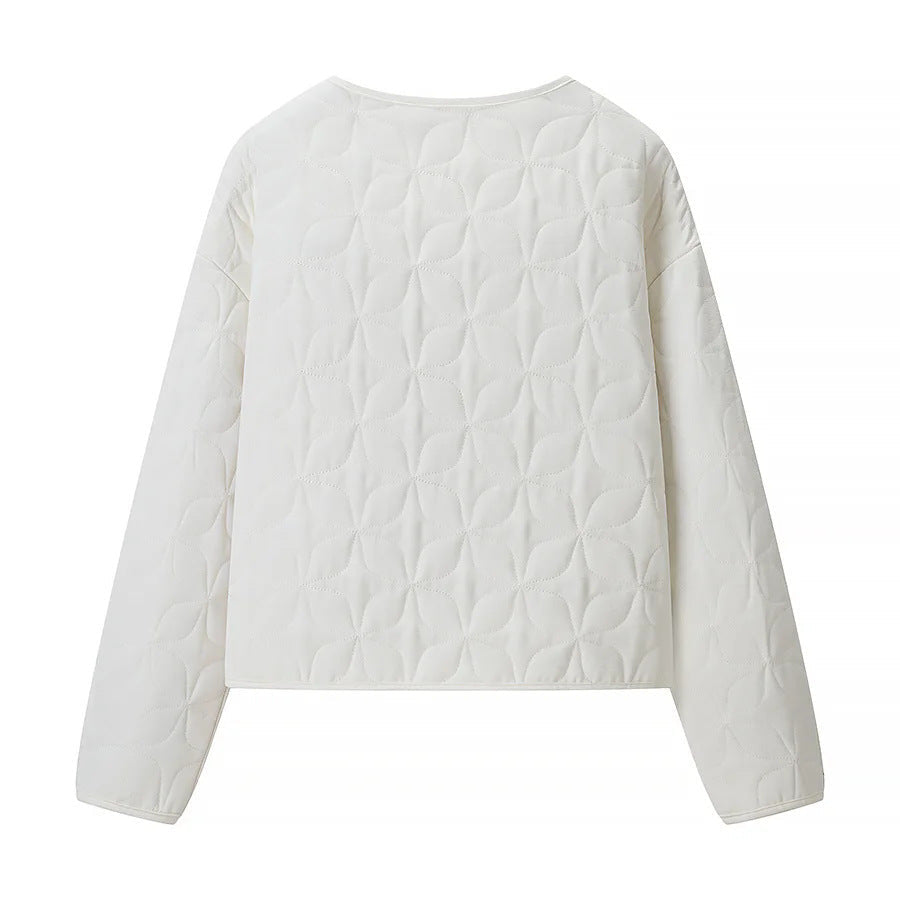 Dam quiltad boxy övergångsjacka med floral quiltad texture, lightly vadderad innerfoder och press stud placket