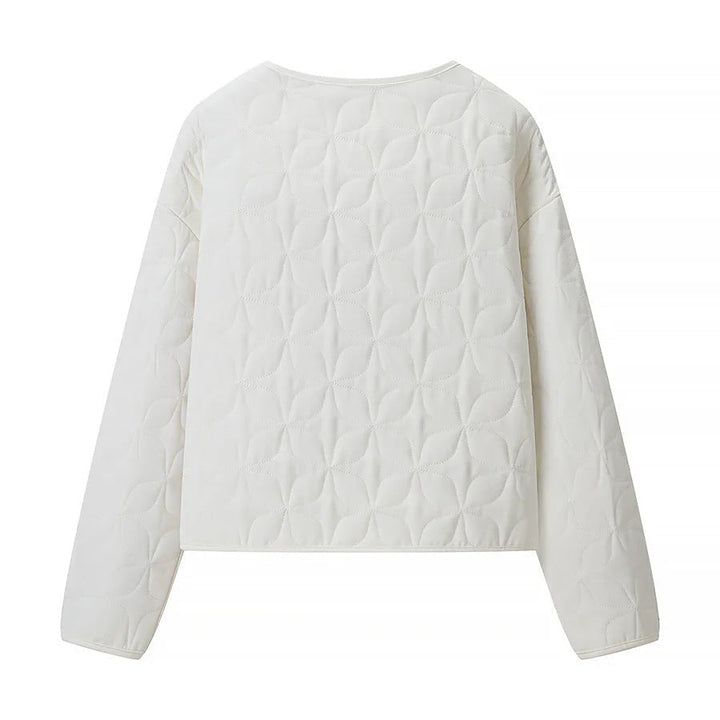 Dam quiltad boxy övergångsjacka med floral quiltad texture, lightly vadderad innerfoder och press stud placket