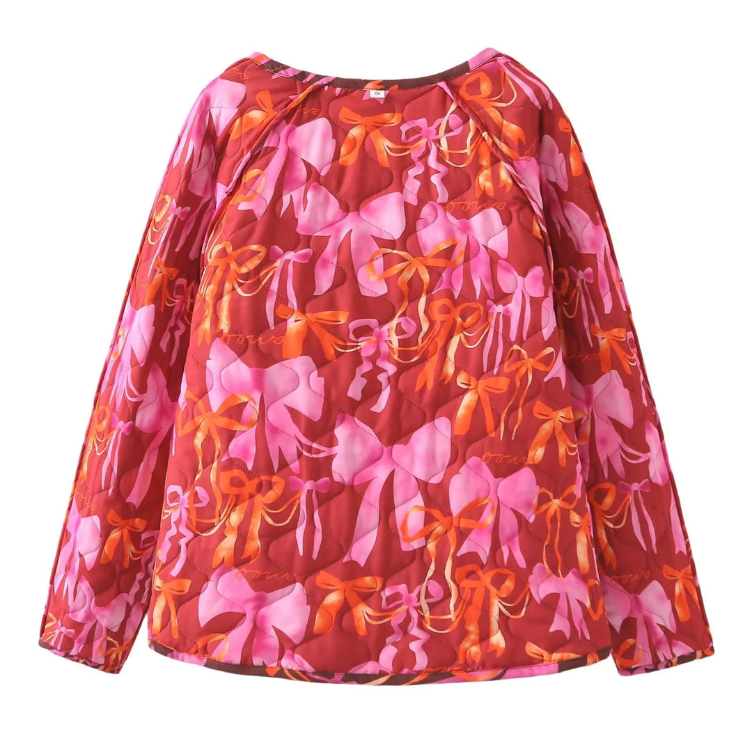 Dam nano quiltad jacka med ribbon tryck, tie loop closure och påsydda fickor