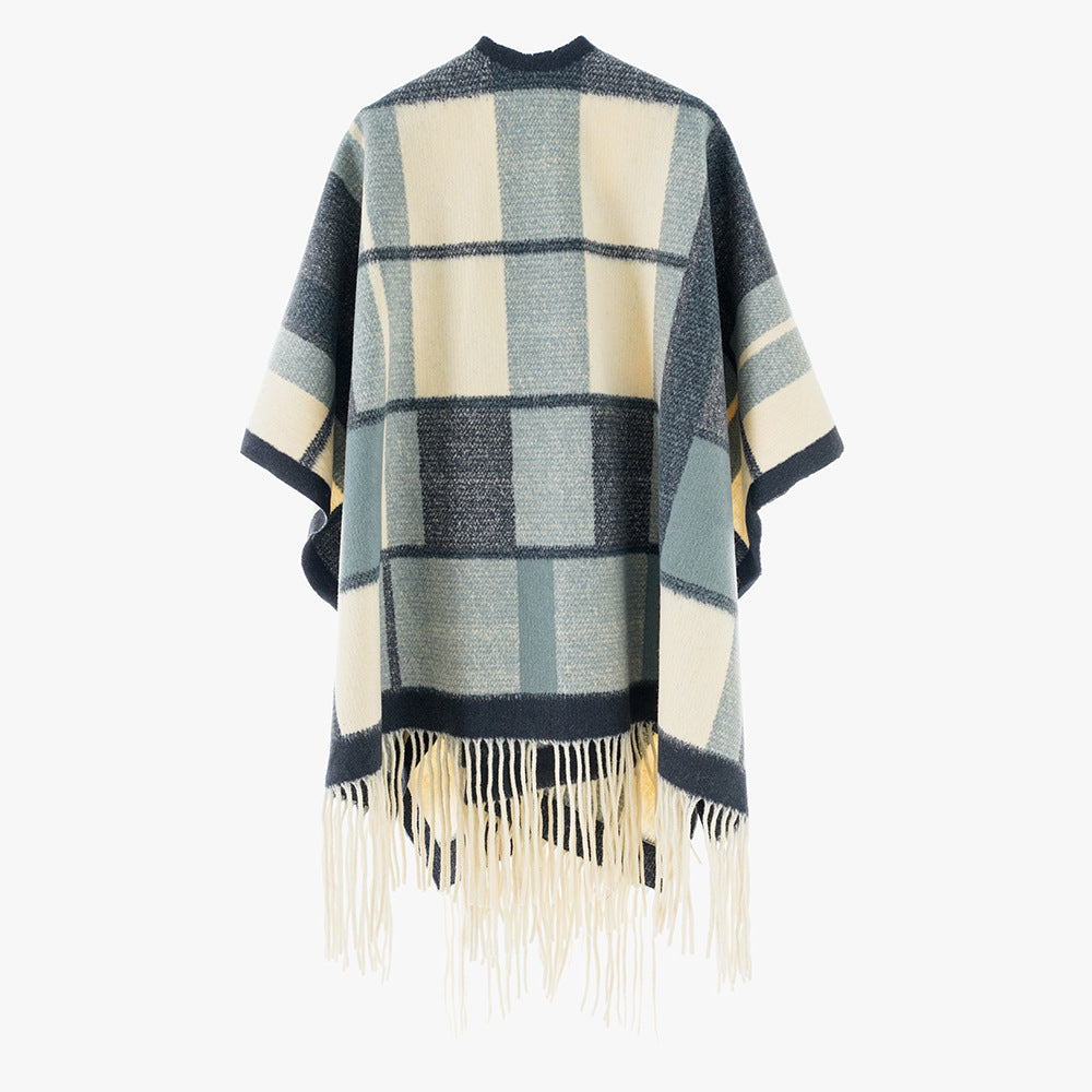 Dam capeponcho i oversized rectangular skärning med rutig weave structure och fringes.
