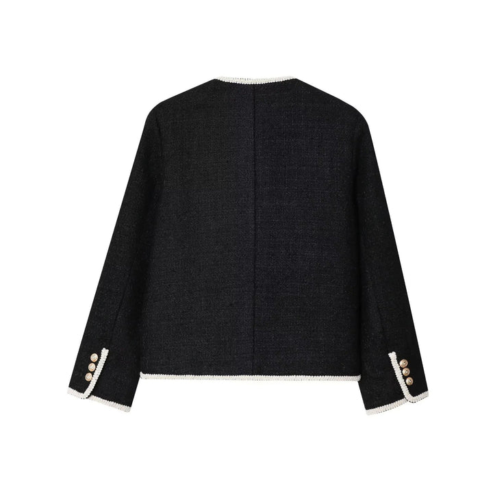 Dam klassisk Boucle jacka med kontrasterande piping och decorative knappar
