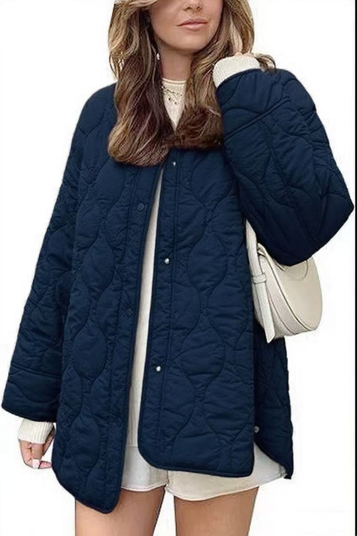 Dam kviltad jacka in oversize design med curved quilting och sido slit