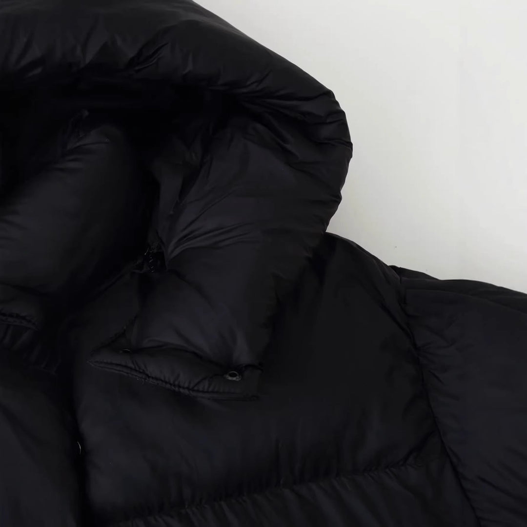 Dam oversized quiltad jacka med voluminous huva och påsydda fickor