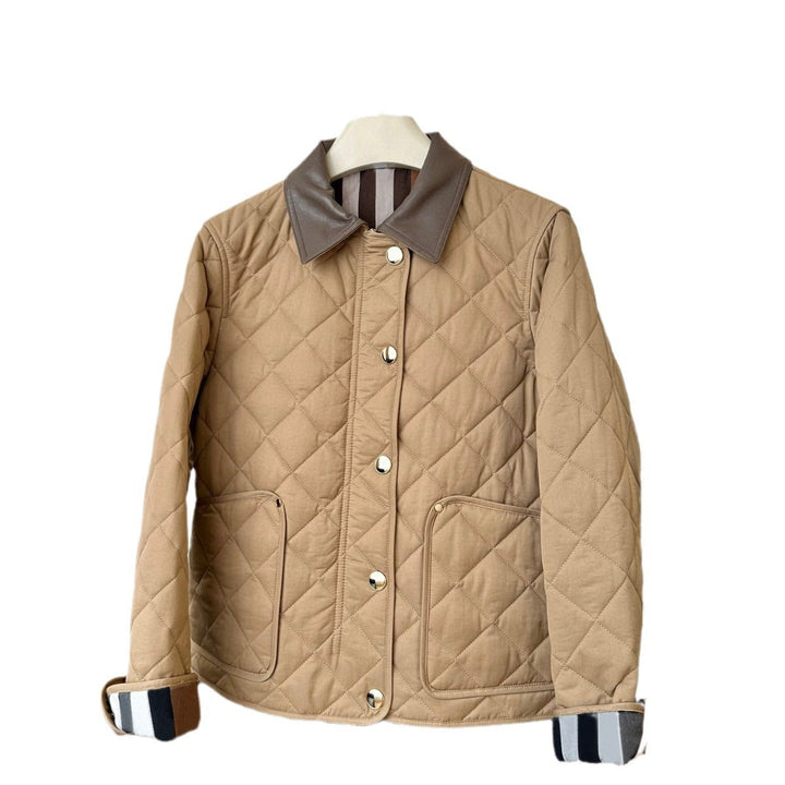 Dam modern kviltad jacka med elegant läder krage