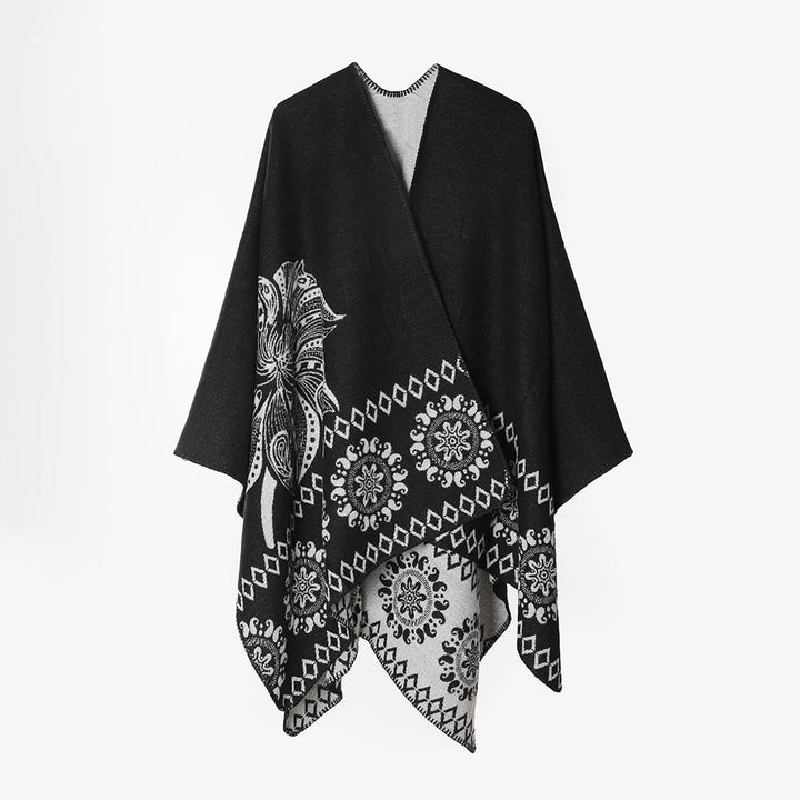 Dam poncho cape med two-tone woven texture, floral medallion jacquard, och öppen front.