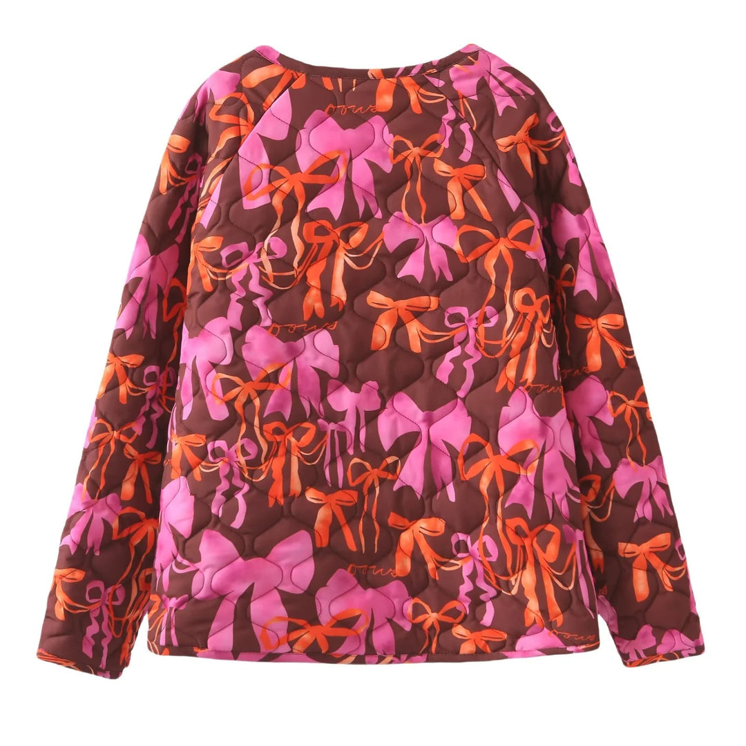 Dam nano quiltad jacka med ribbon tryck, tie loop closure och påsydda fickor